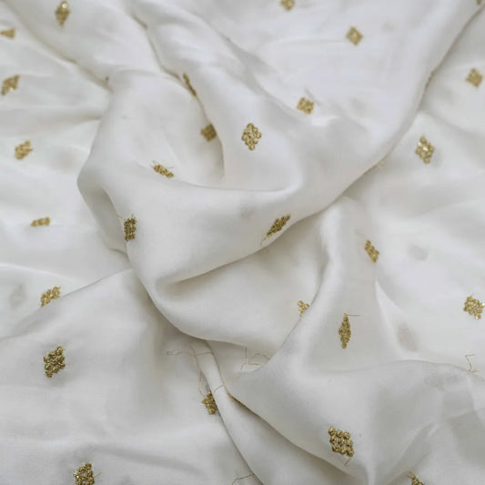 Golden Buti Work Embroidery With Lagdi Pata Border On White Dyeable Gaji Silk Fabric